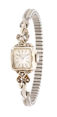 A Collection of Platinum, 14 Karat White Gold and Diamond Wristwatches,