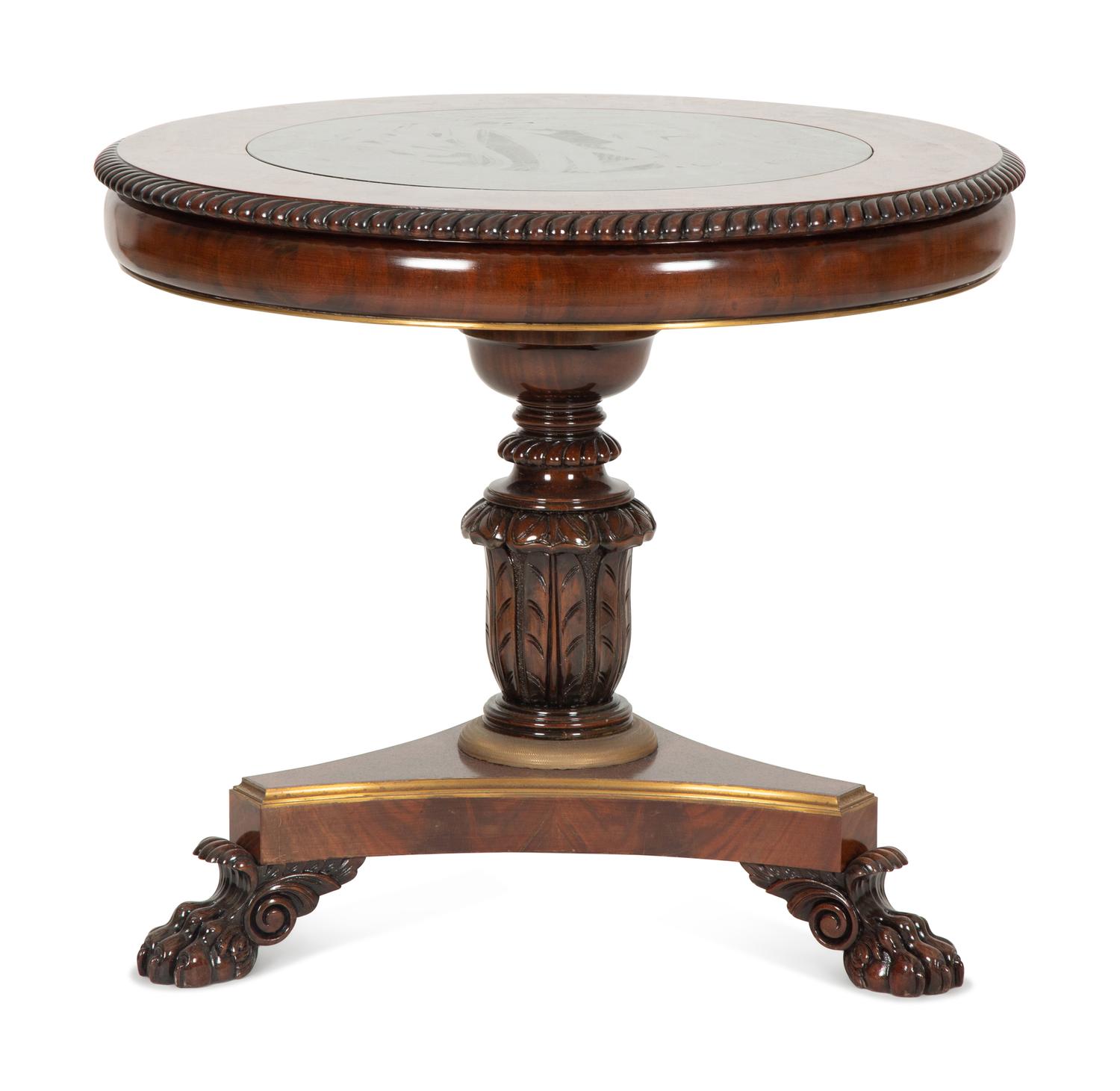 A Regency Style Mahogany and Rosewood Crossbanded Center Table with Inset Marble Top