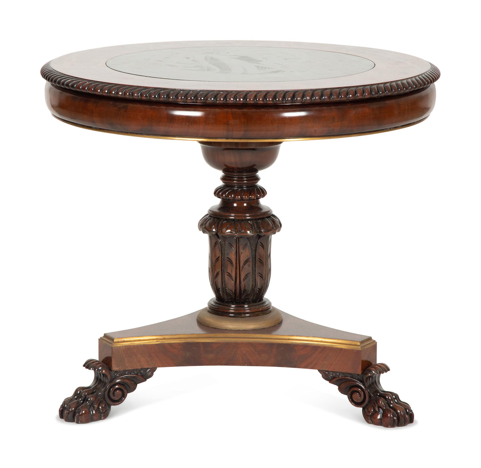 A Regency Style Mahogany and Rosewood Crossbanded Center Table with Inset Marble Top