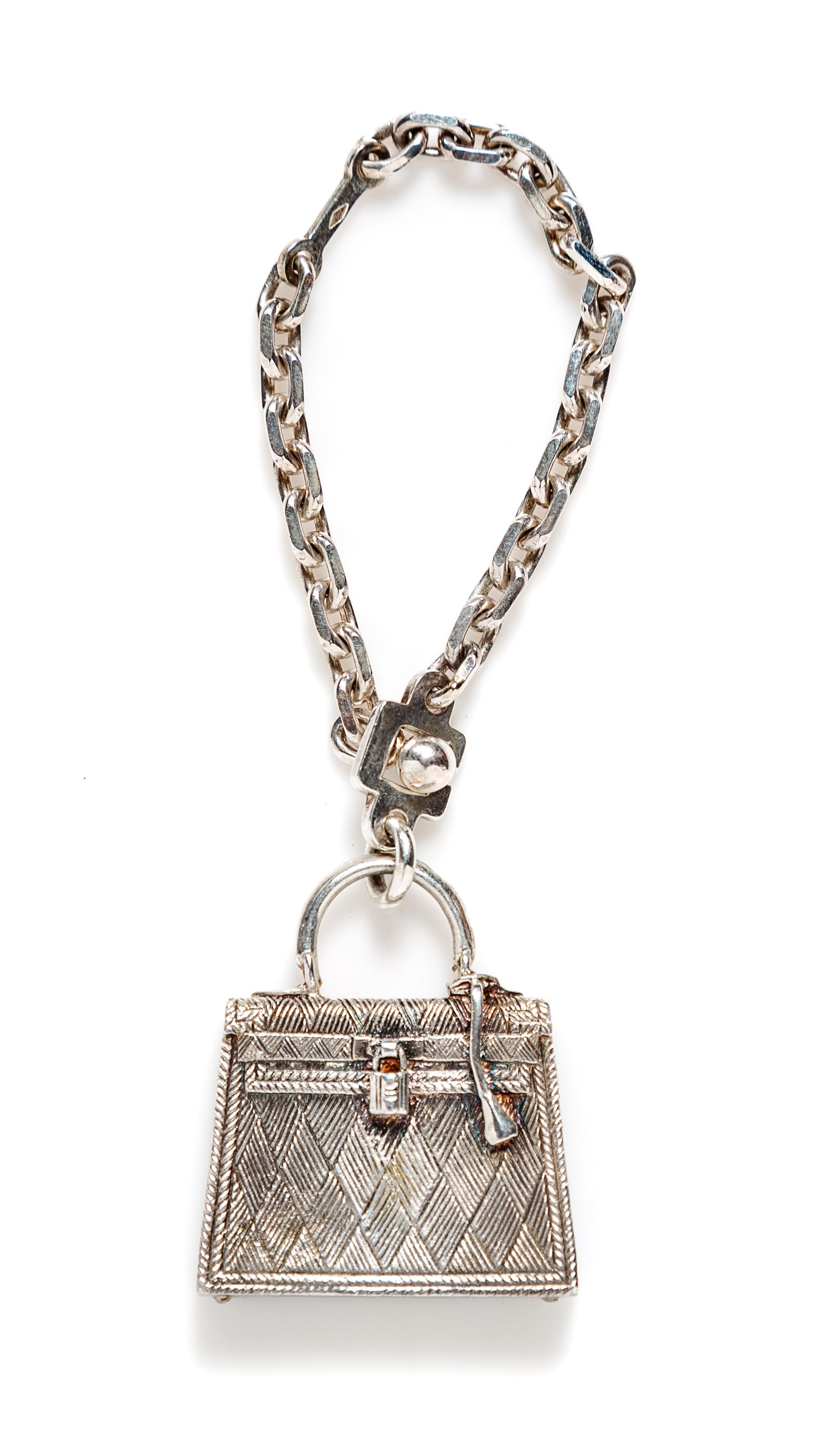 An Hermès Sterling Silver Kelly Bag Touareg Charm,