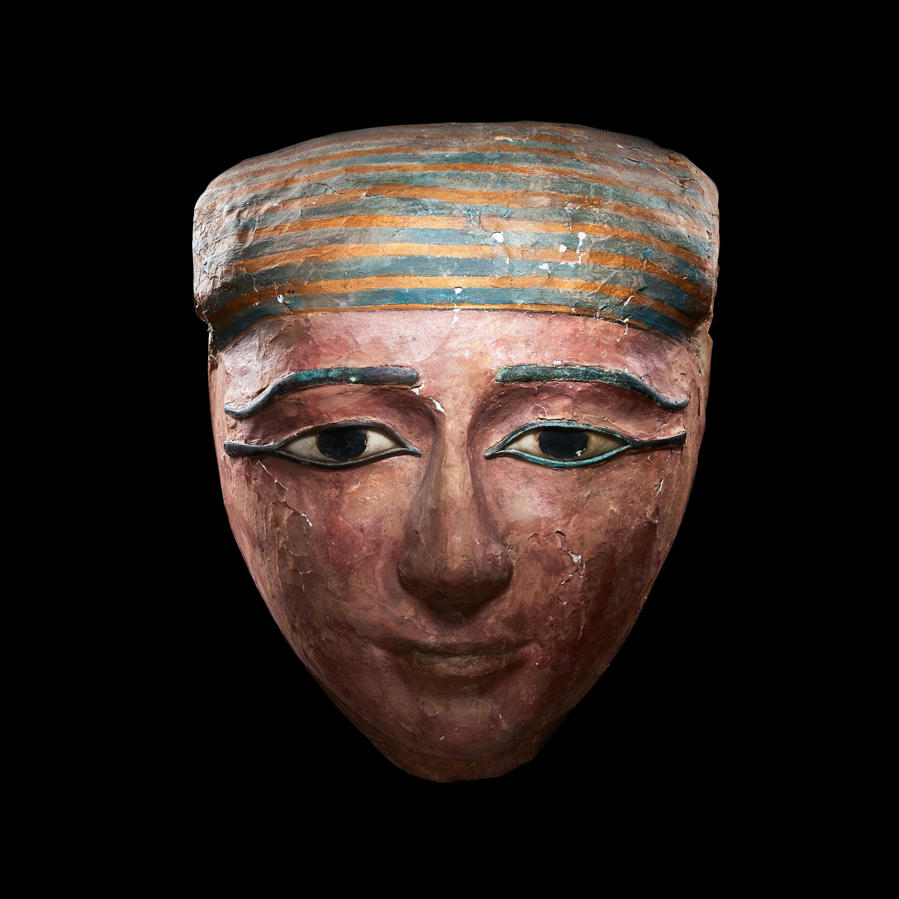 An Egyptian Polychrome Wood Mummy Mask with Bronze Inlays
