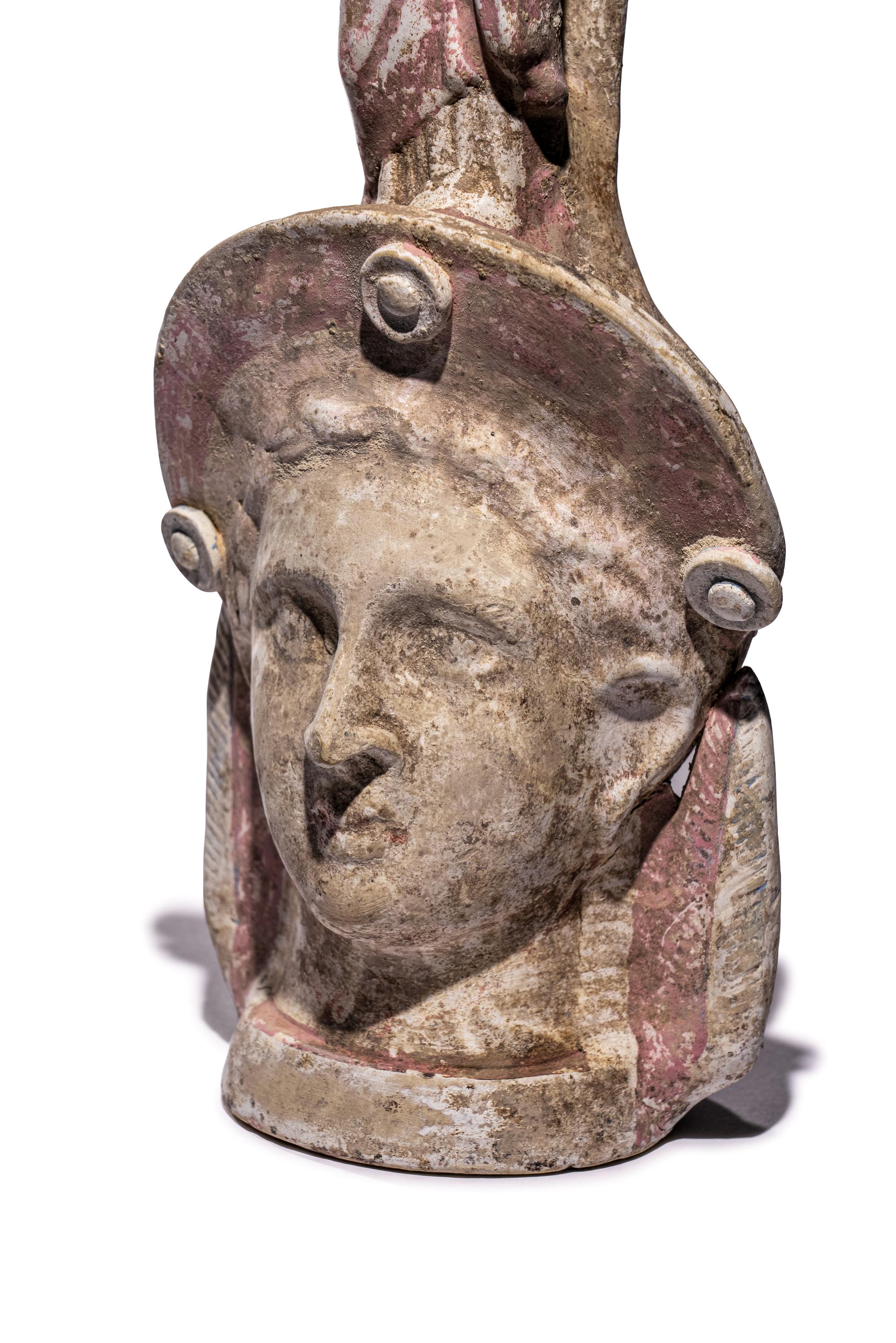 A Canosan Pottery Figural Oinochoe