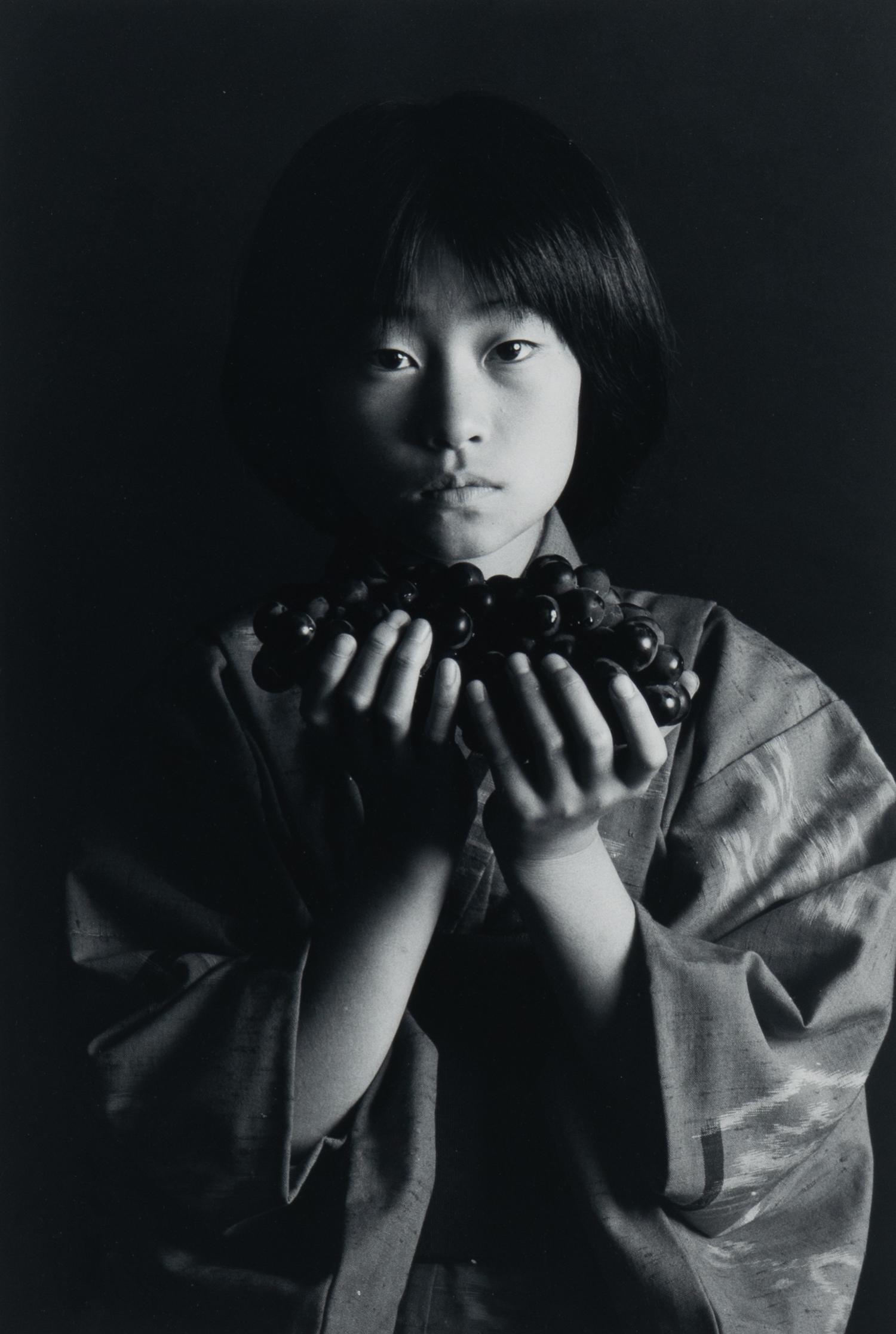 Andy Katz (American, 20th/21st century) — Girl with Grapes