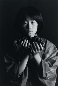 Andy Katz (American, 20th/21st century) — Girl with Grapes