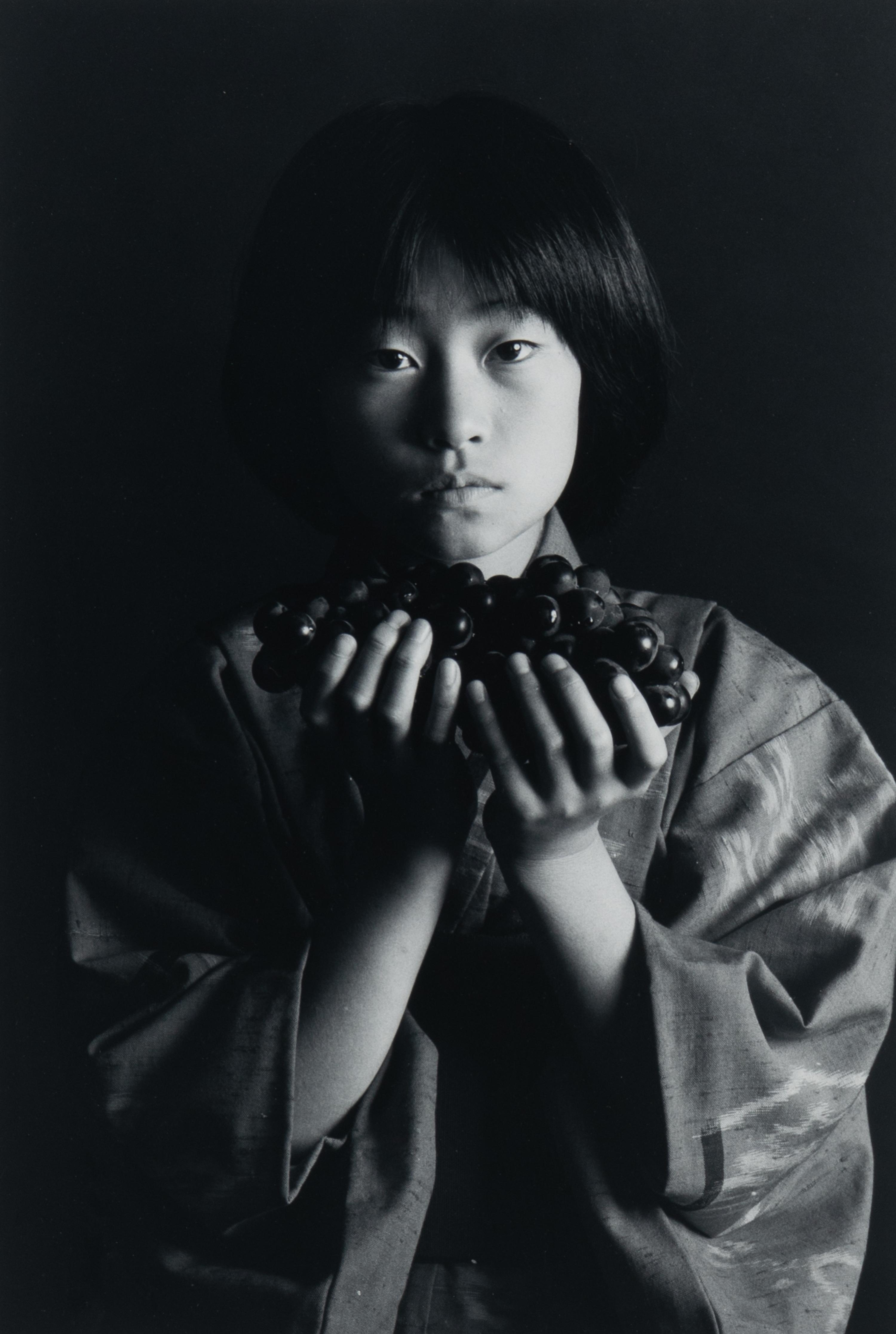 Andy Katz (American, 20th/21st century) — Girl with Grapes