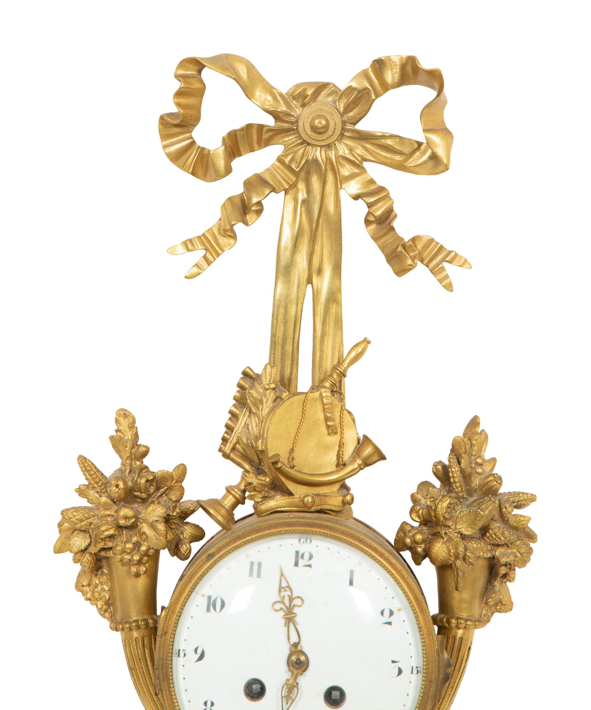 A Louis XVI Style Gilt Bronze Cartel Clock