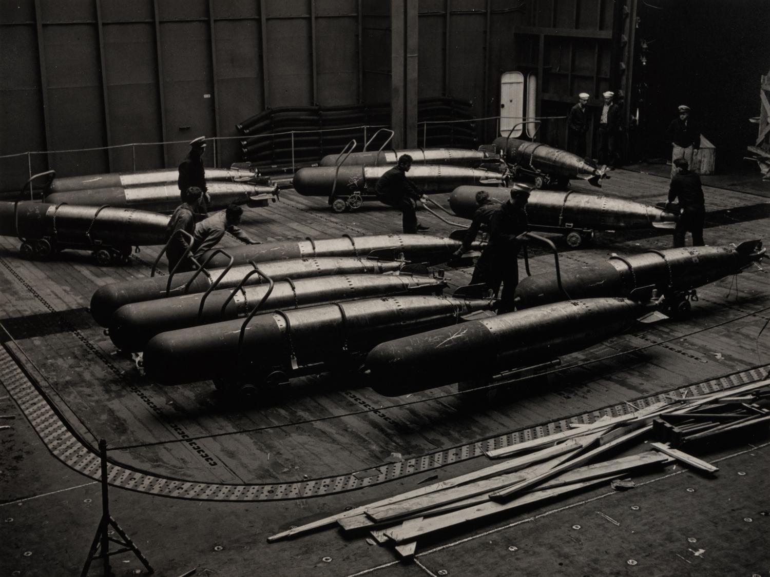 IANNELLI, Fons (1919-1988). Crew with Naval Torpedoes, U.S.S. Yorktown . c. 1943.