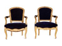 A Pair of Louis XV Giltwood Fauteuils
