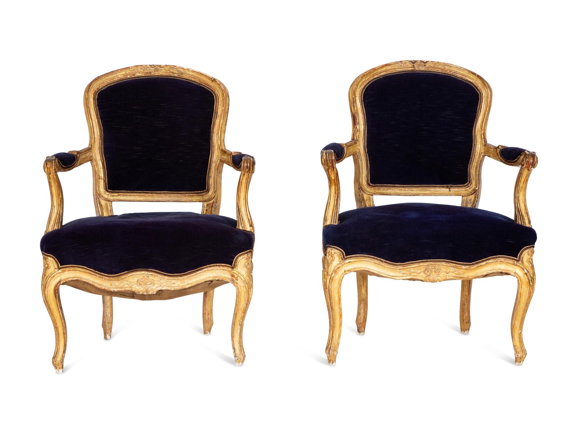 A Pair of Louis XV Giltwood Fauteuils