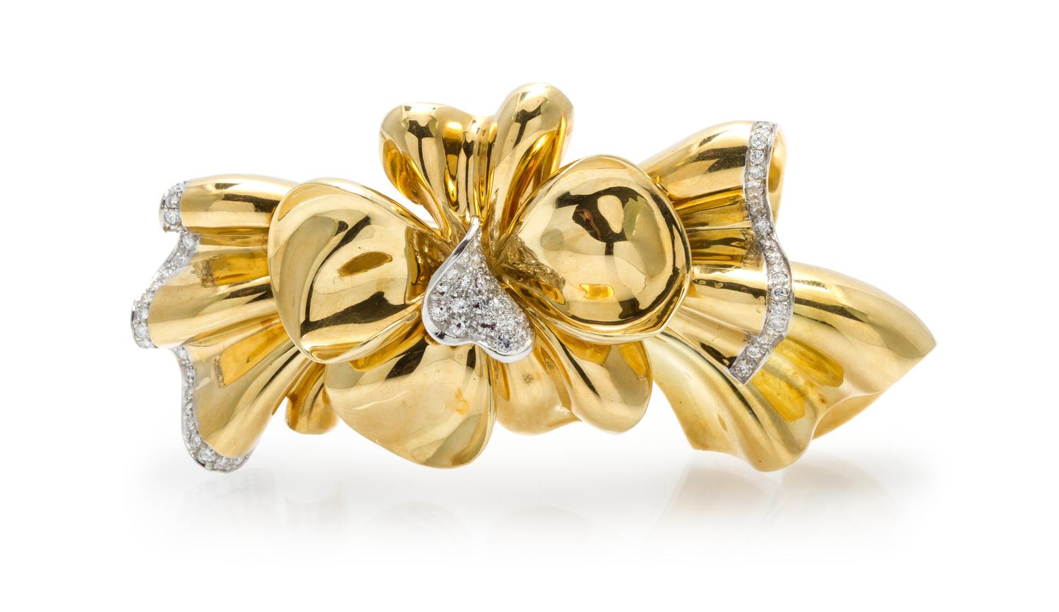 An 18 Karat Yellow Gold and Diamond Bow Brooch, Circa 1960, 38.20 dwts.