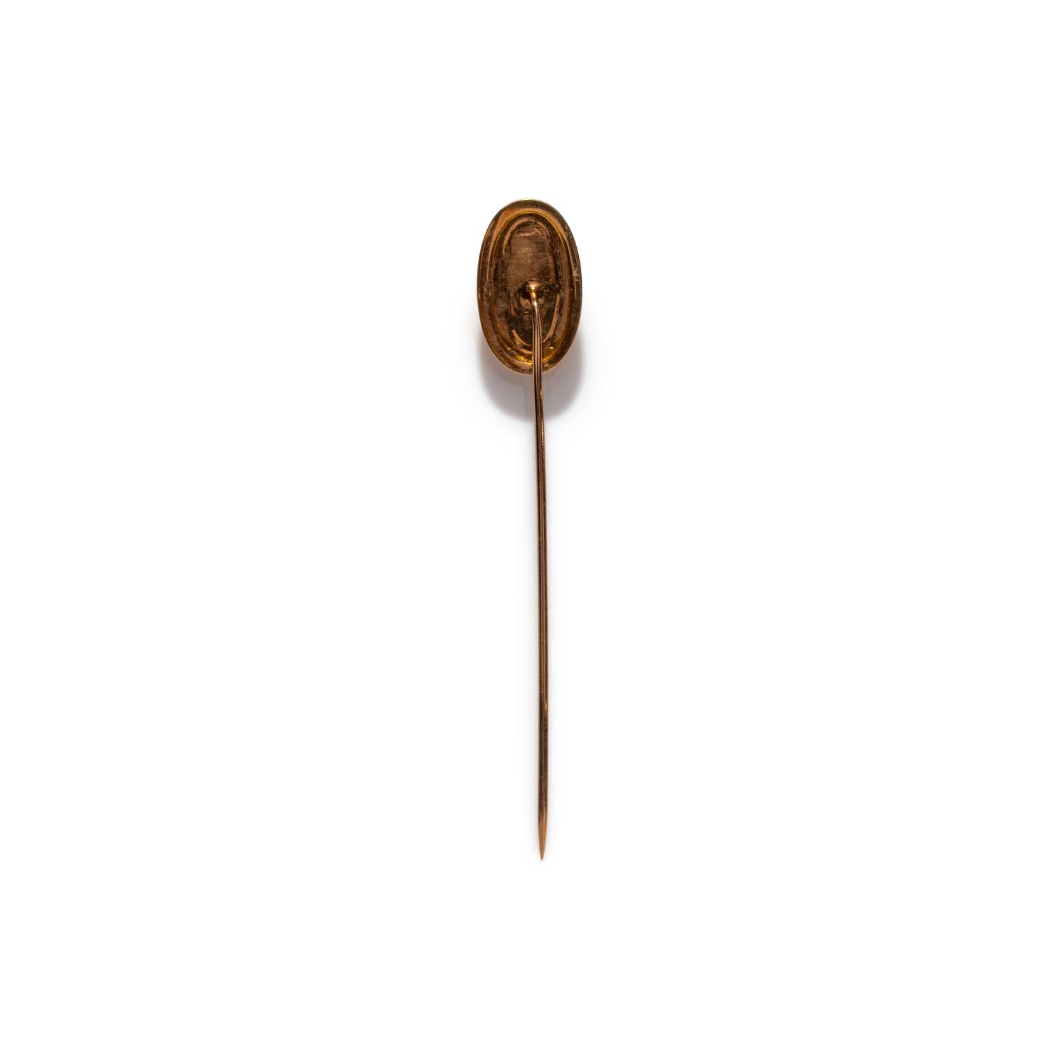 A Neoclassical Gold and Onyx Cameo Stickpin with a Goddess or Muse