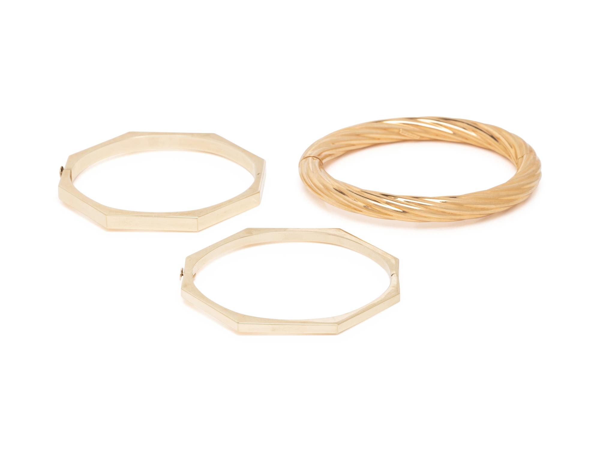 THREE YELLOW GOLD BANGLE BRACELETS