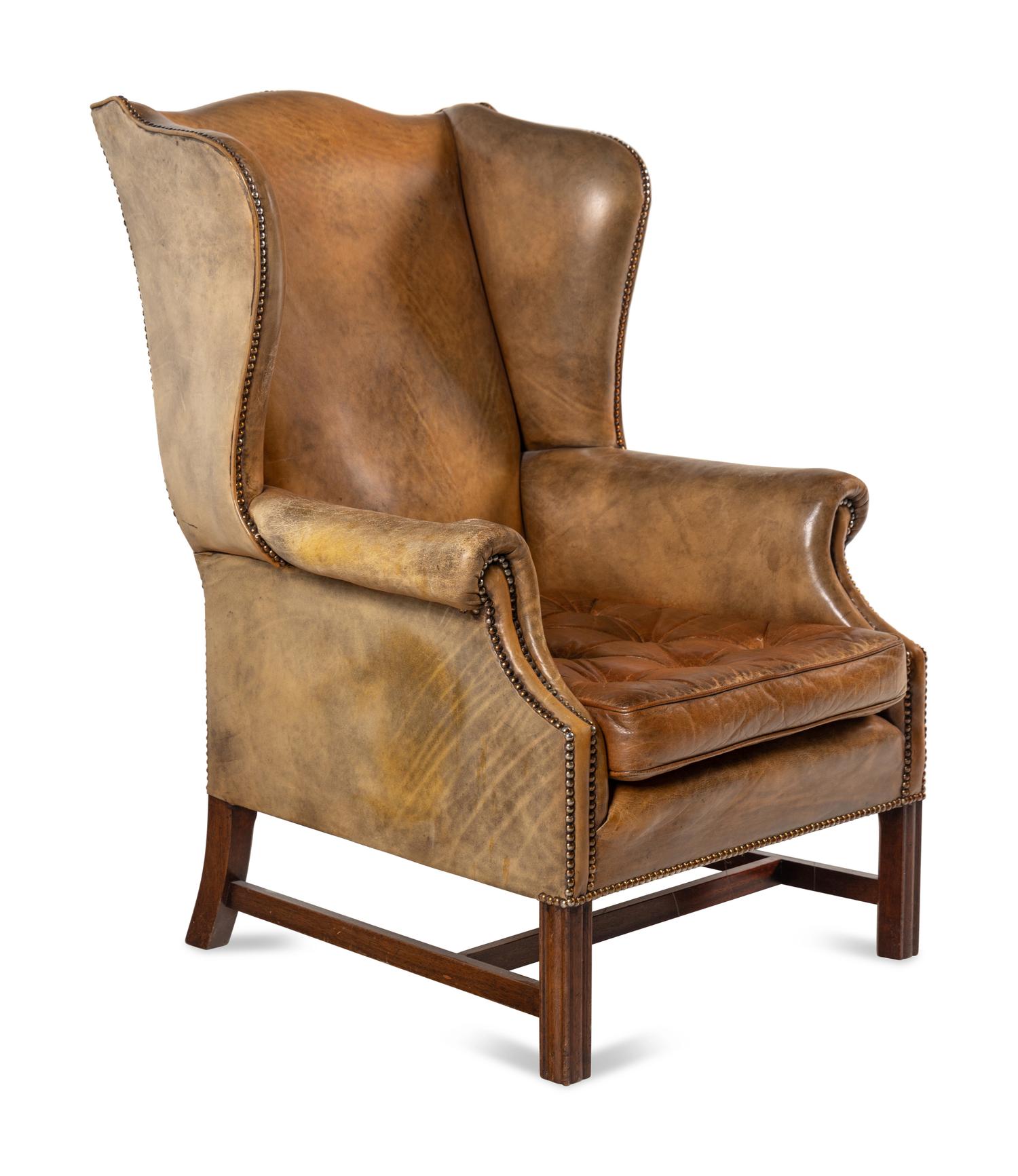A George III Style Leather Upholstered Wingback Armchair