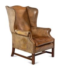A George III Style Leather Upholstered Wingback Armchair