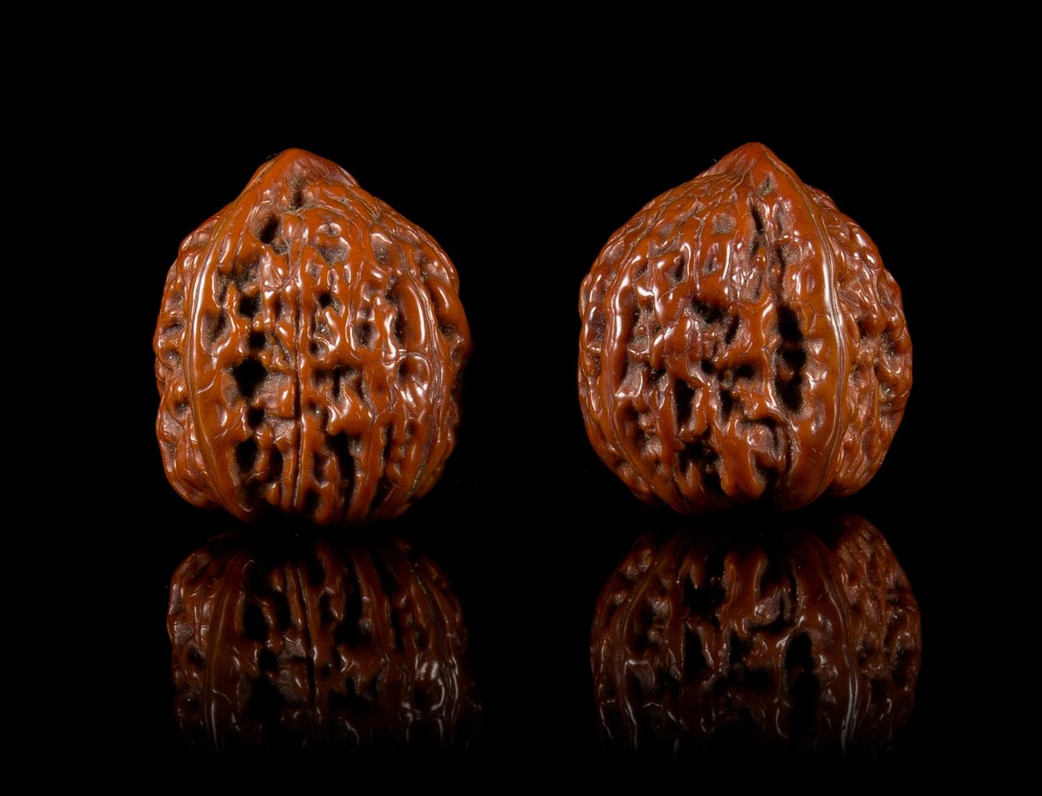 Two Carved Walnuts Length of each 1 1/2 inches.
