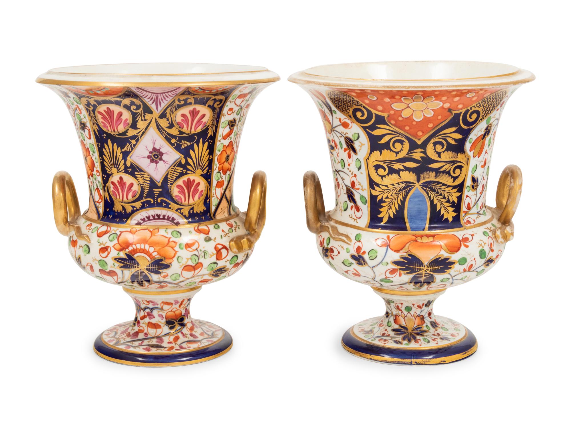 A Near Pair of Derby Porcelain Campagna Urns