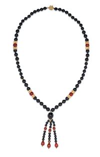A 14 Karat Yellow Gold, Onyx and Carnelian Beaded Tassel Necklace, 55.44 dwts.