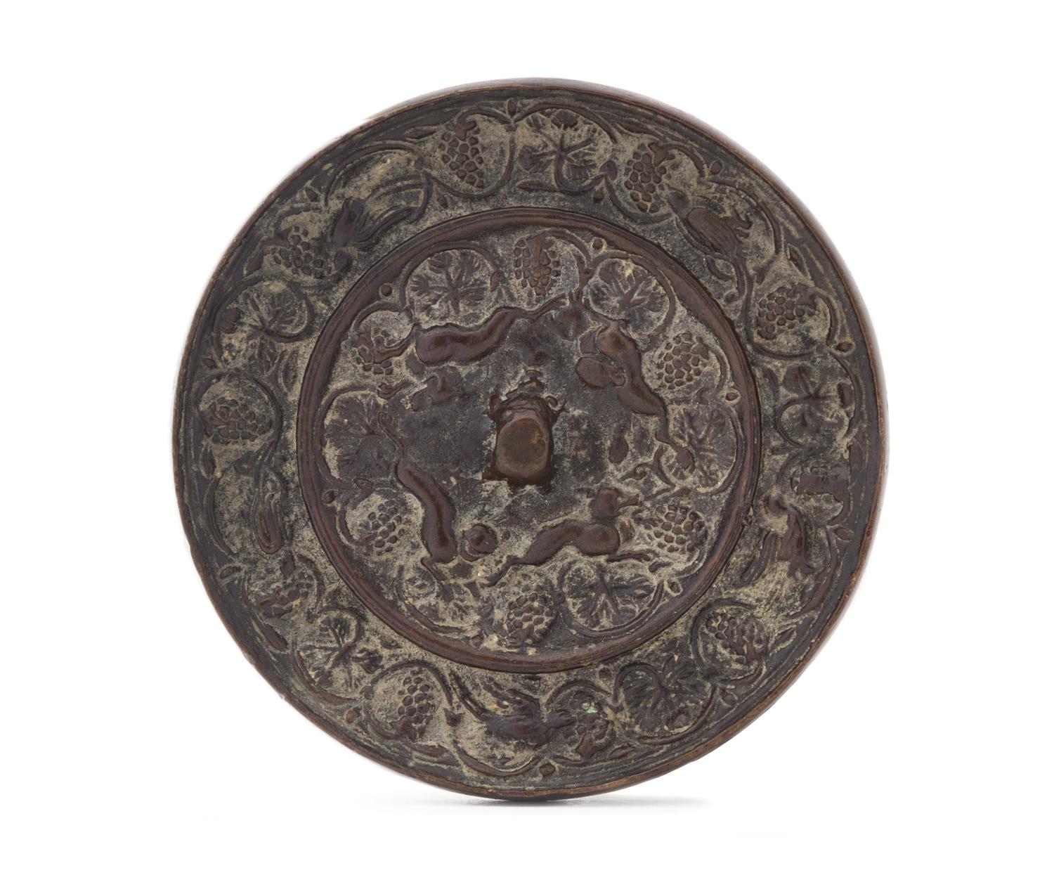 A Bronze 'Grapevine and Beast' Circular Mirror Diameter 3 7/8 inches.