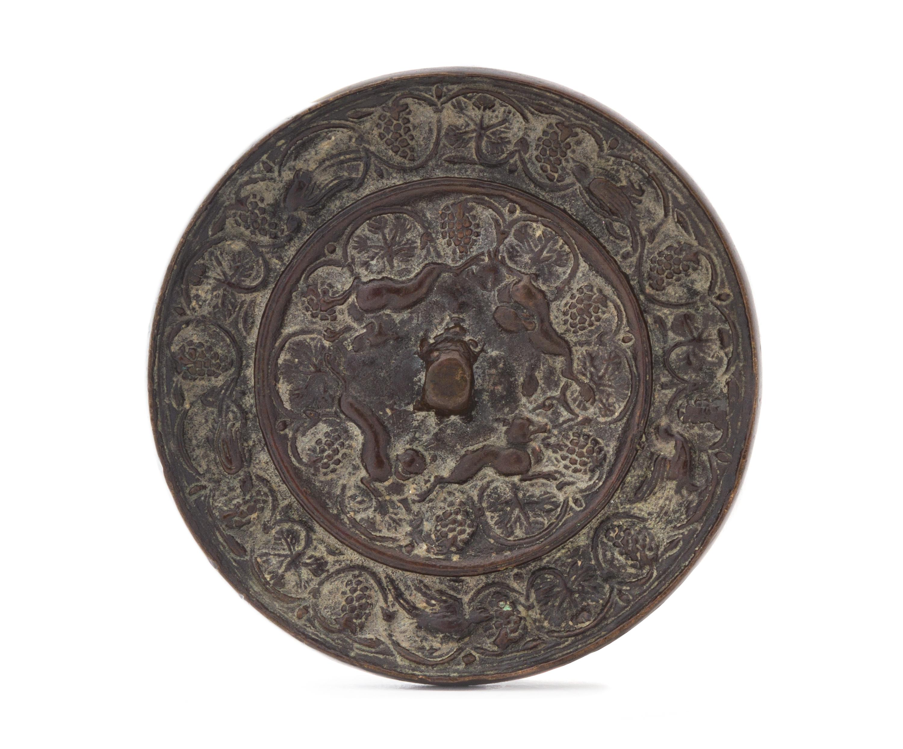 A Bronze 'Grapevine and Beast' Circular Mirror Diameter 3 7/8 inches.