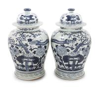 Two Pairs of Chinese Blue and White Porcelain Jars and Covers