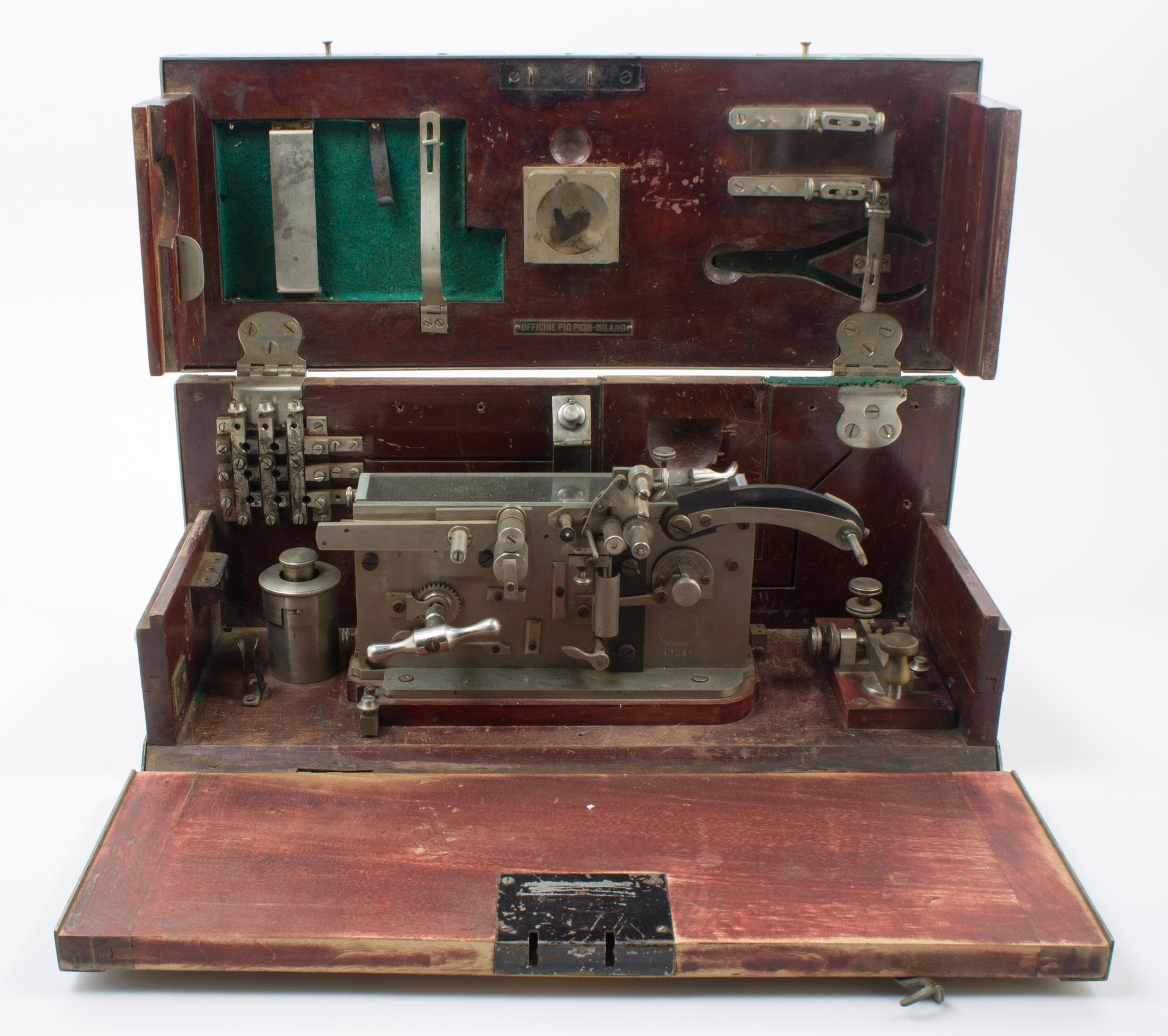 An Italian Cased Field Telegraph Set Height of case 8 1/2 x width 20 x depth 8 inches. — WESTERN ELECTRIC ITALIANA, FIRST QUARTER 20TH CENTURY