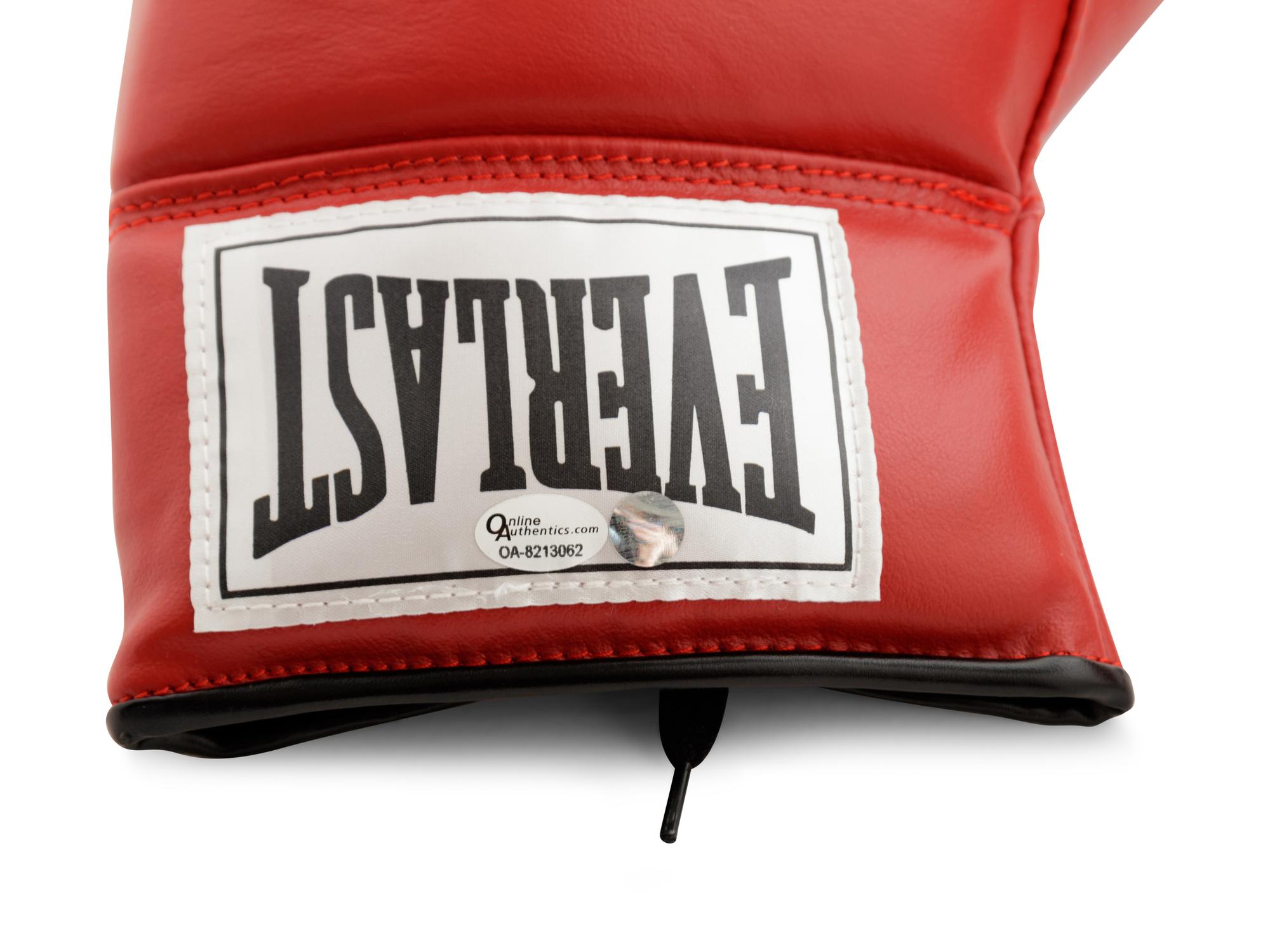 A Pair of Muhammad Ali Boxing Gloves (One Signed),