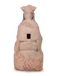 A Chinese Carved Stone Seated Figure with Polychrome Decoration