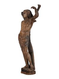 An Italian Carved and Polychromed Figure of St. Sebastian Tied to the Tree