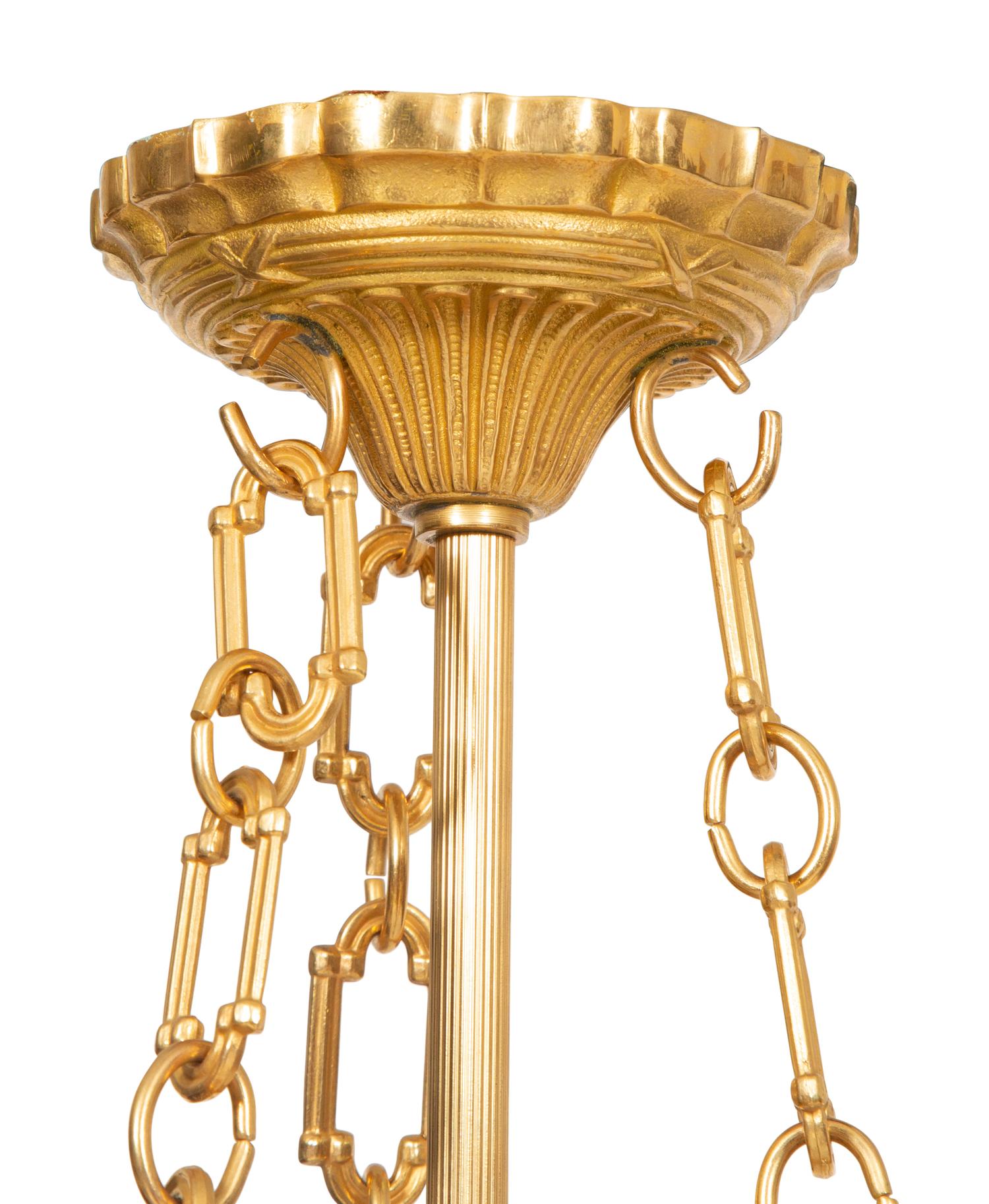 A Pair of French Gilt Metal and Glass Lanterns