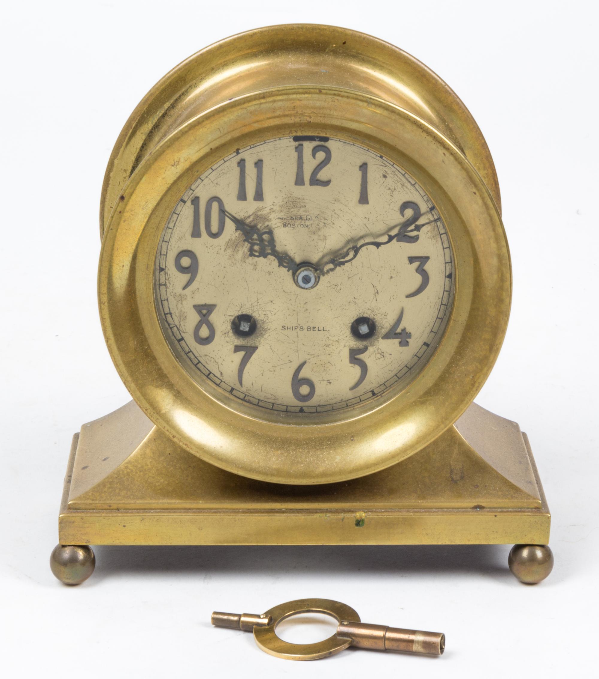 A Brass Chelsea Ship's Bell Clock Height 7 inches. — 20TH CENTURY