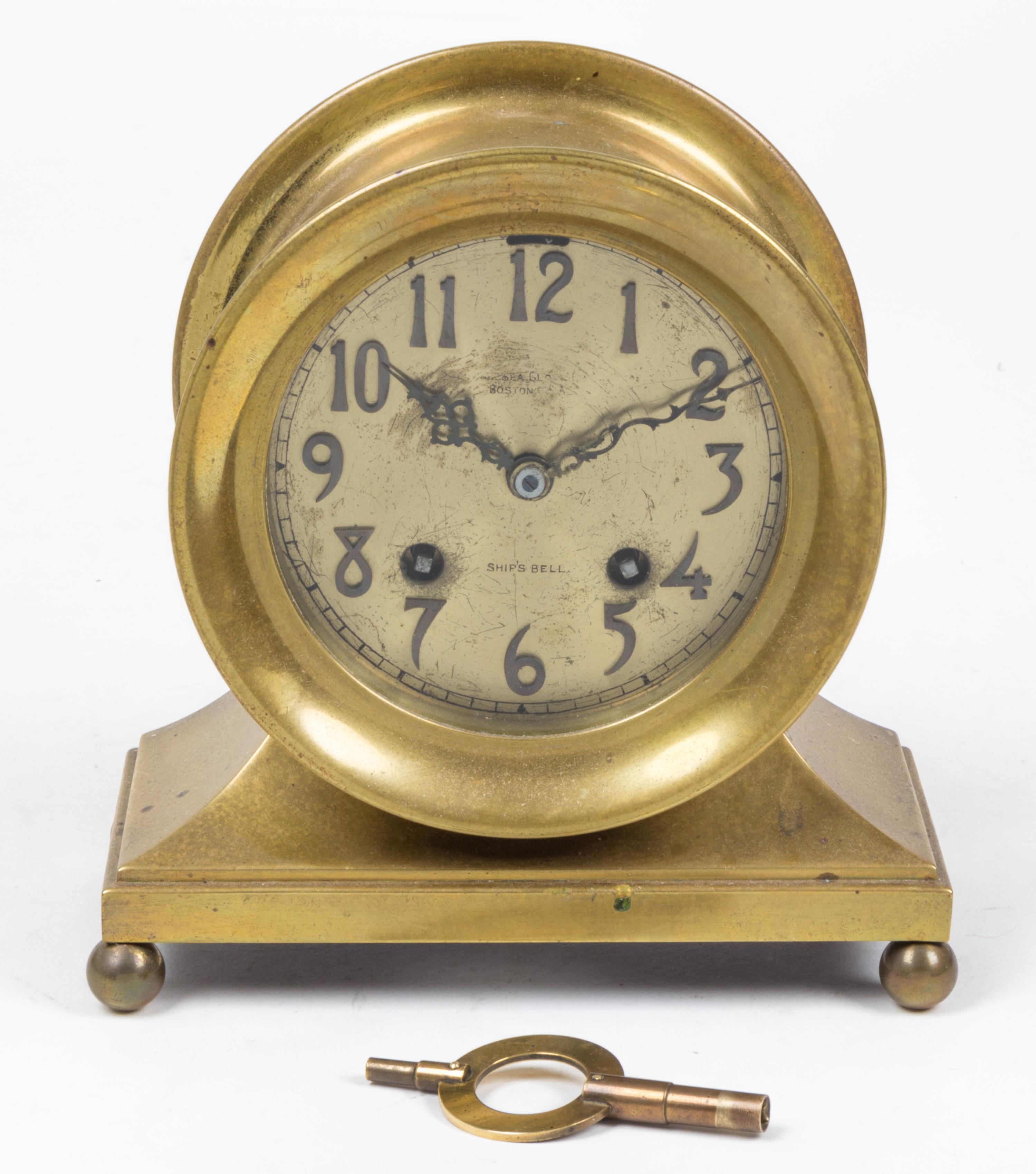 A Brass Chelsea Ship's Bell Clock Height 7 inches. — 20TH CENTURY