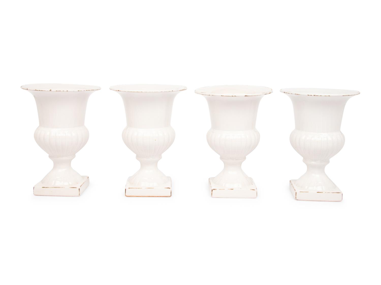 A Set of Four White Glazed Faience Urns