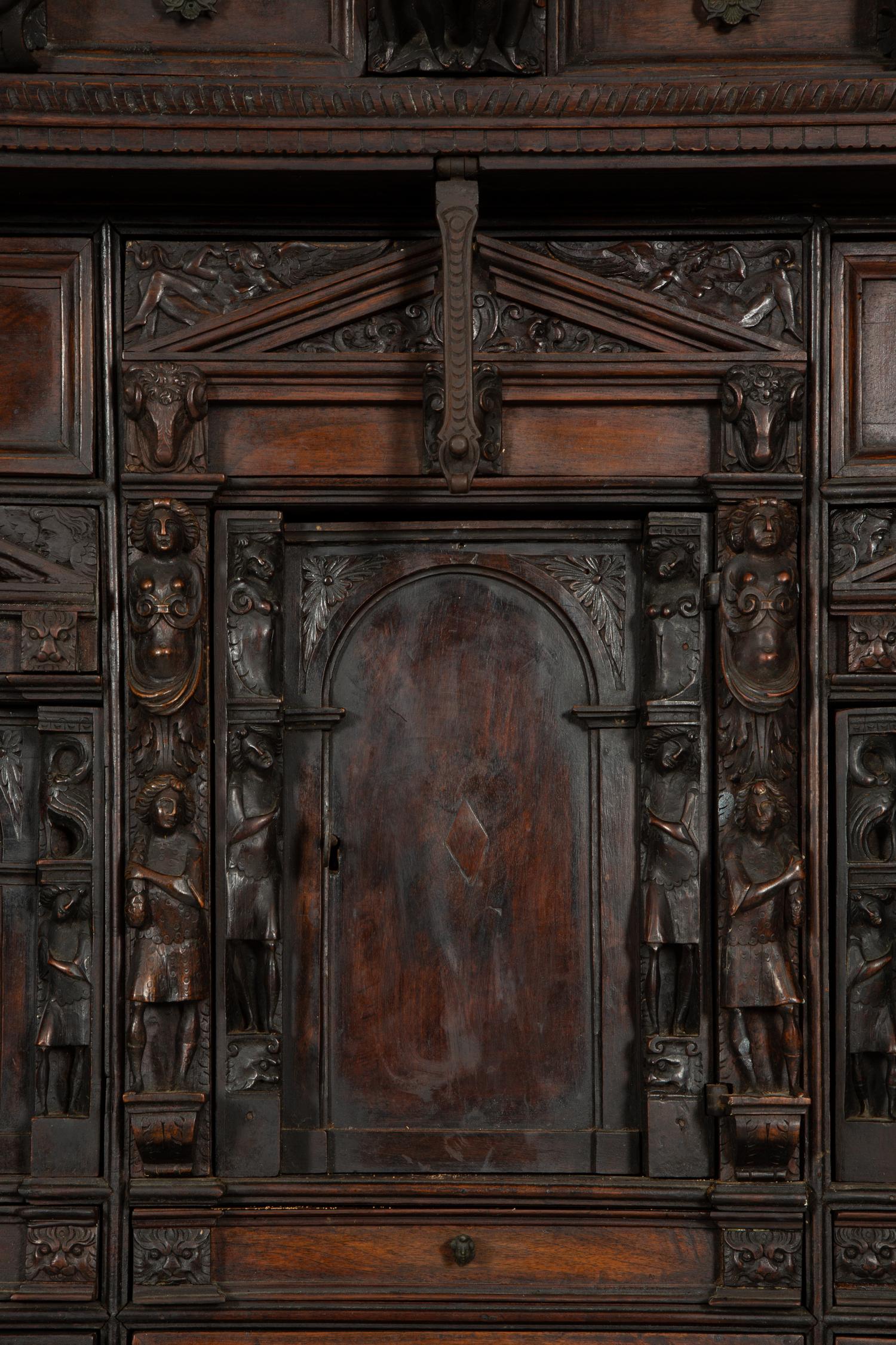 A Continental Baroque Walnut Cabinet