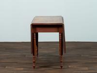 A Late Federal Cherrywood Drop-Leaf Dining Table