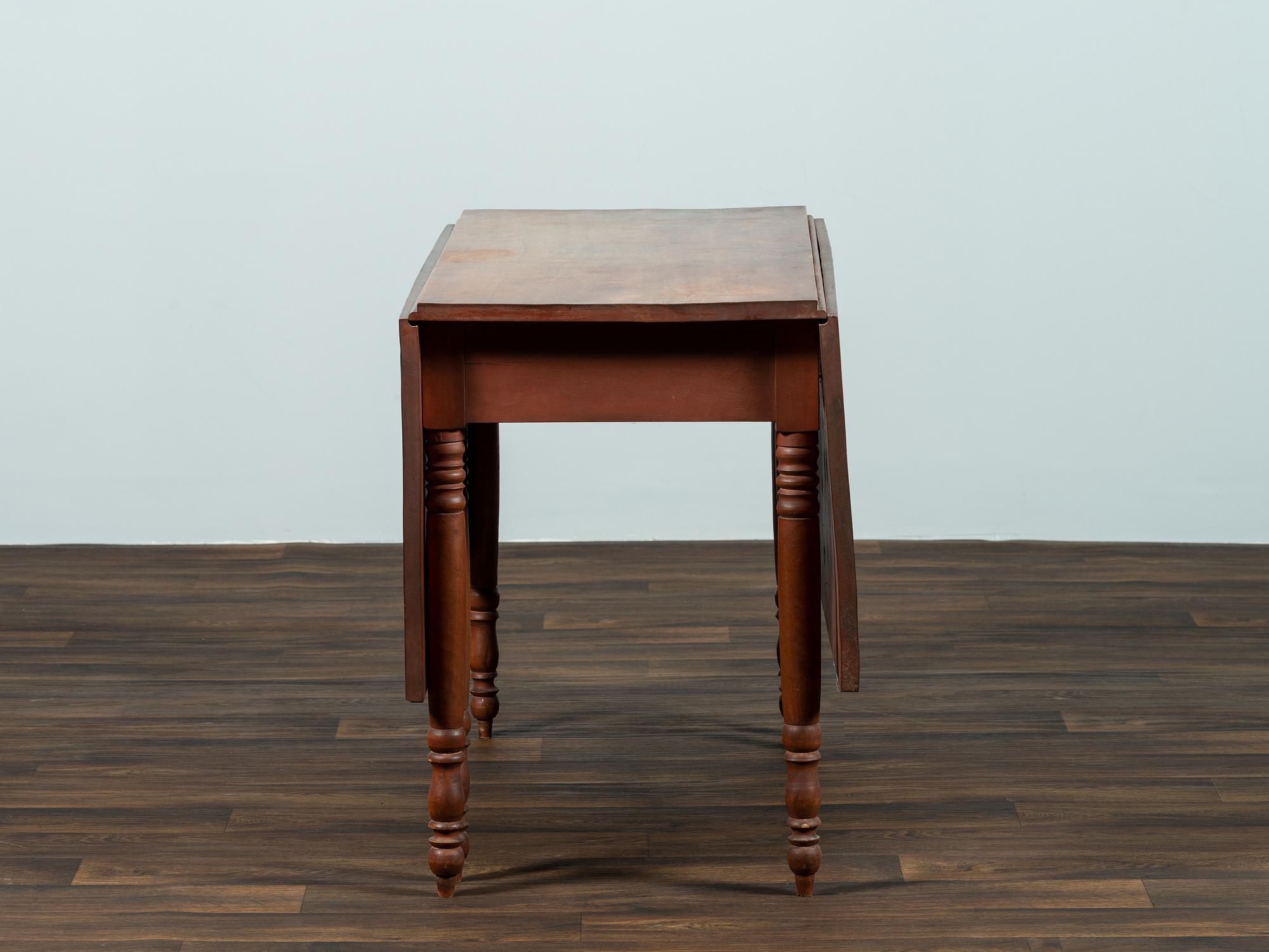 A Late Federal Cherrywood Drop-Leaf Dining Table