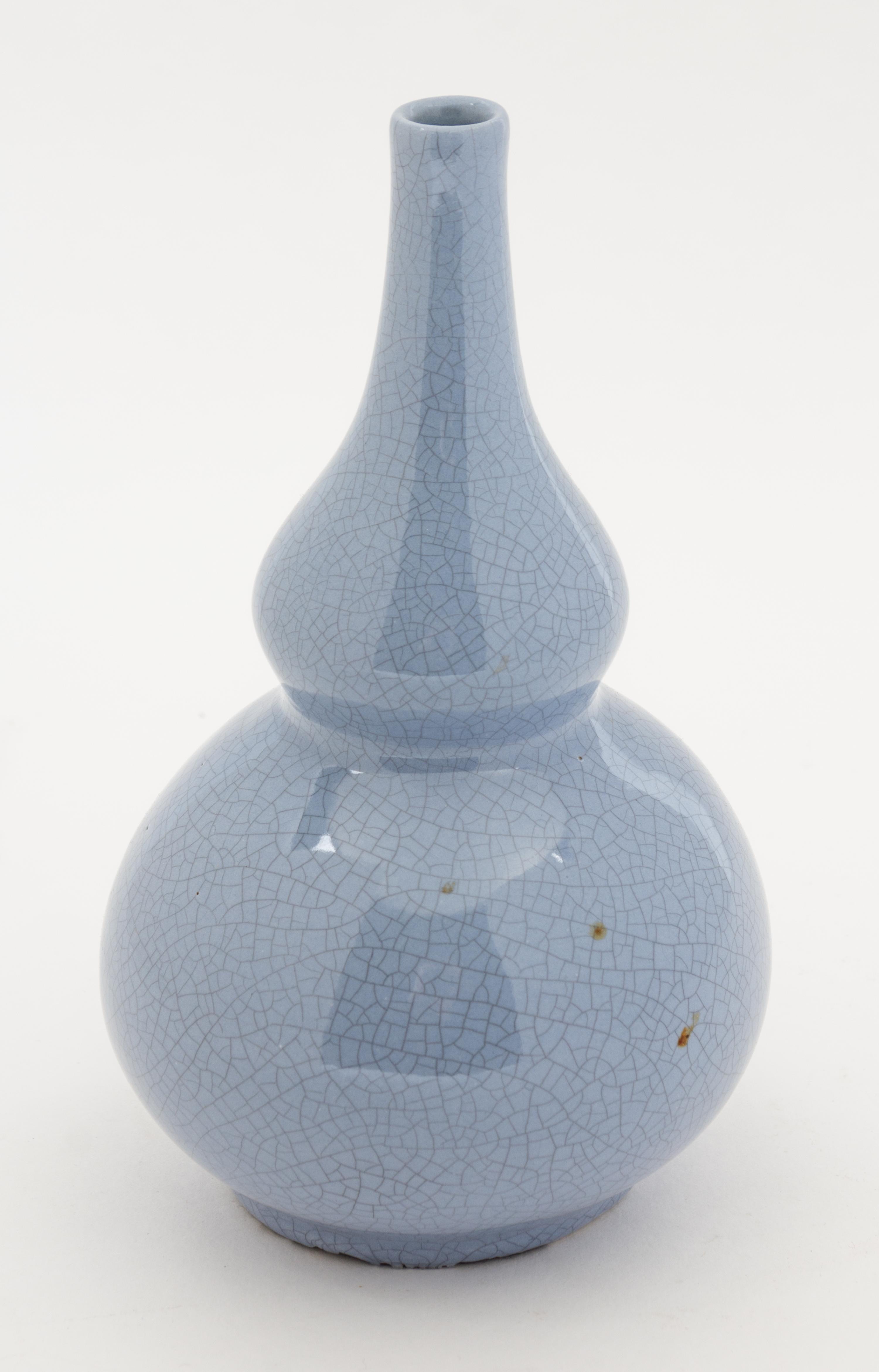 A Pale Blue Crackled Glaze Double-Gourd Form Vase. Height 7 1/4 inches.