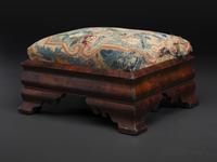 An American Empire Mahogany Veneered and Needlepoint Upholstered Footstool