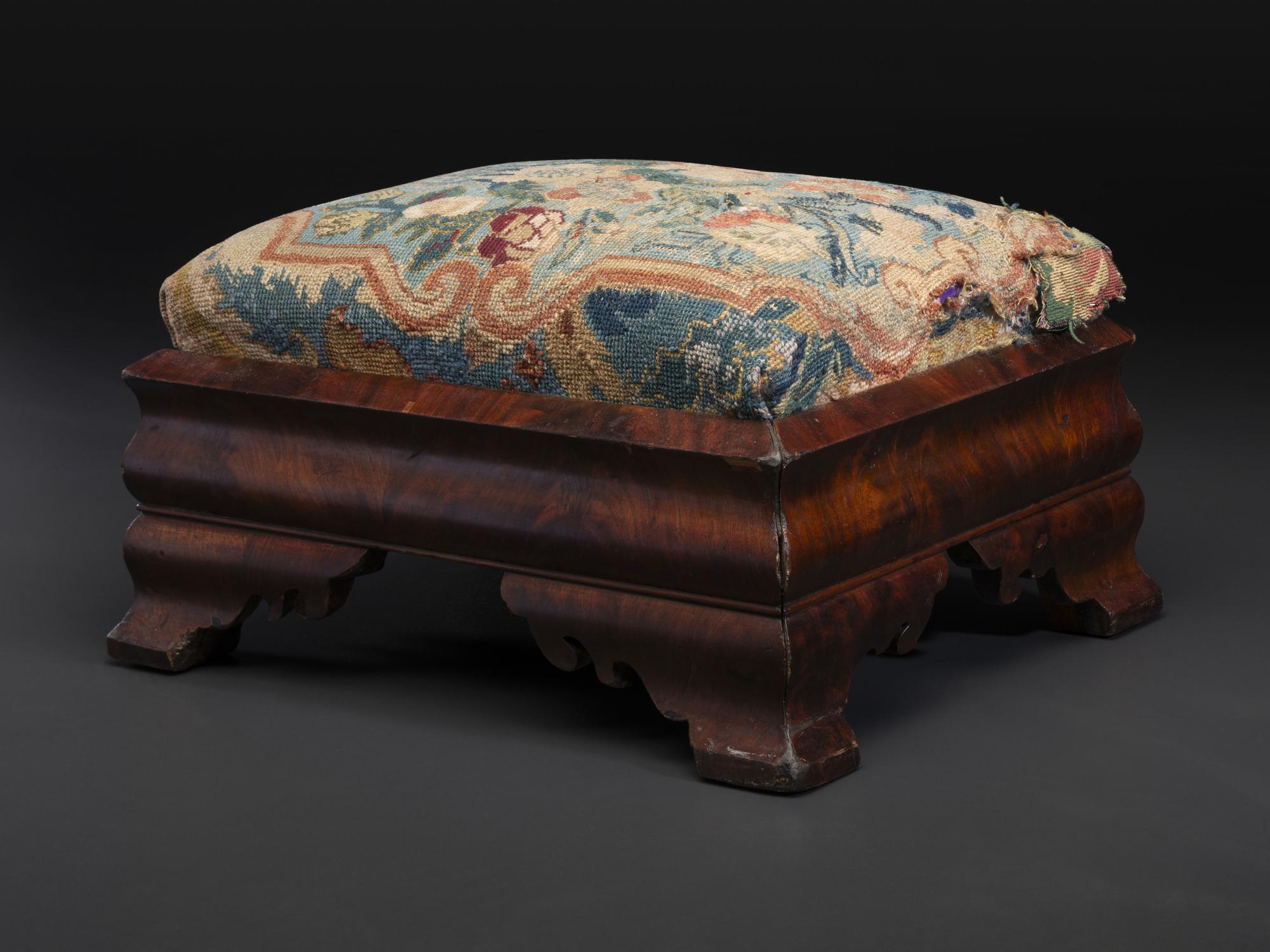 An American Empire Mahogany Veneered and Needlepoint Upholstered Footstool