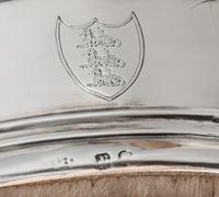 A Pair of George III Silver Two-Bottle Wine Trollies, Philip Bachelor, London, 1792, each with wood centers and raised on four feet wit