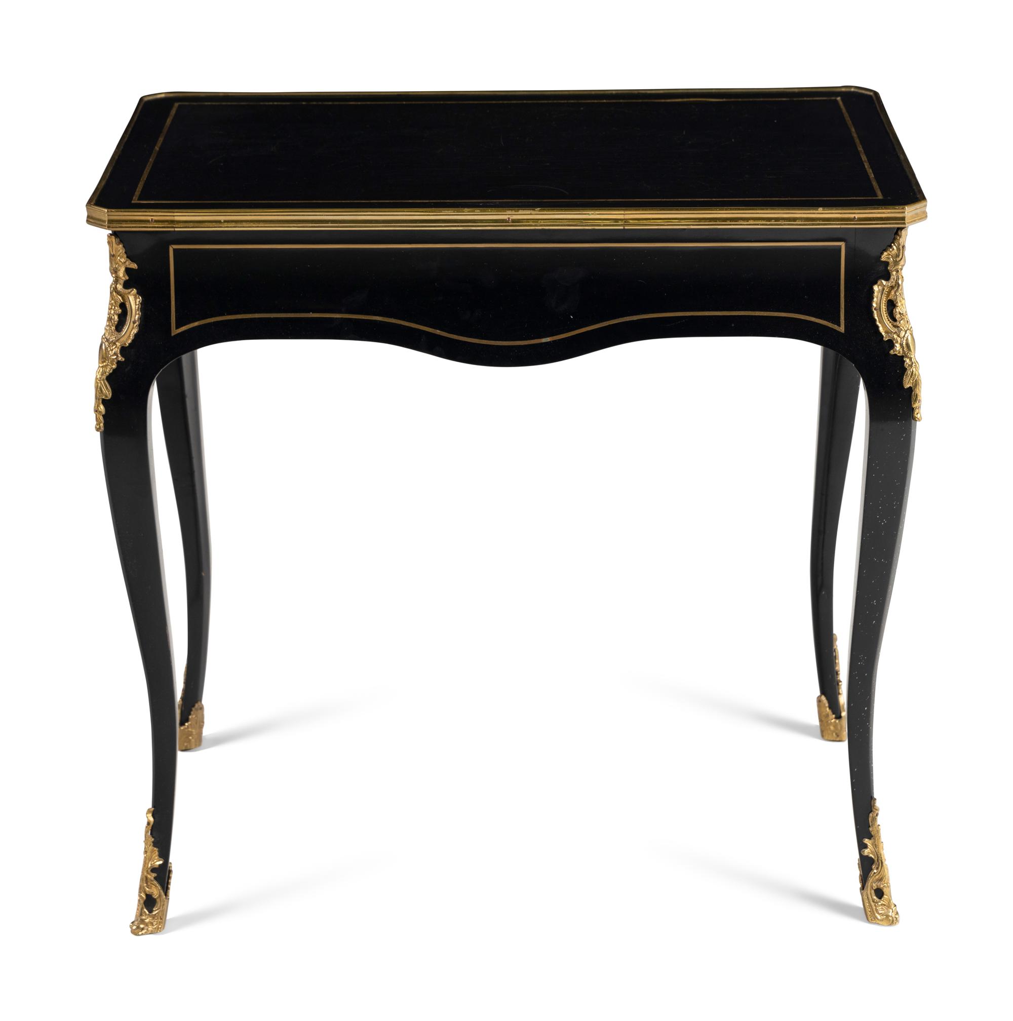A Napoleon III Style Gilt Bronze Mounted Ebonized Table