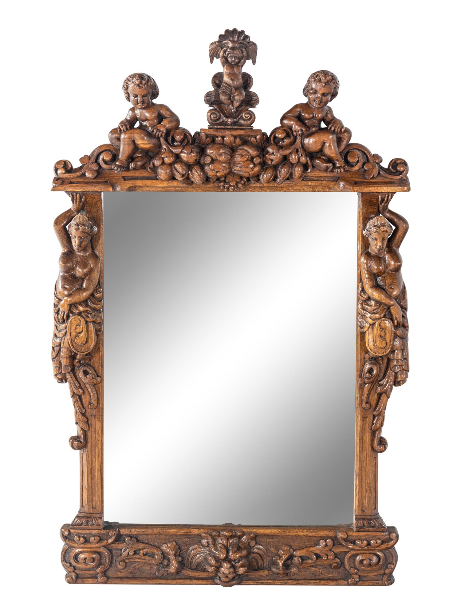 A Renaissance Revival Carved Oak Mirror