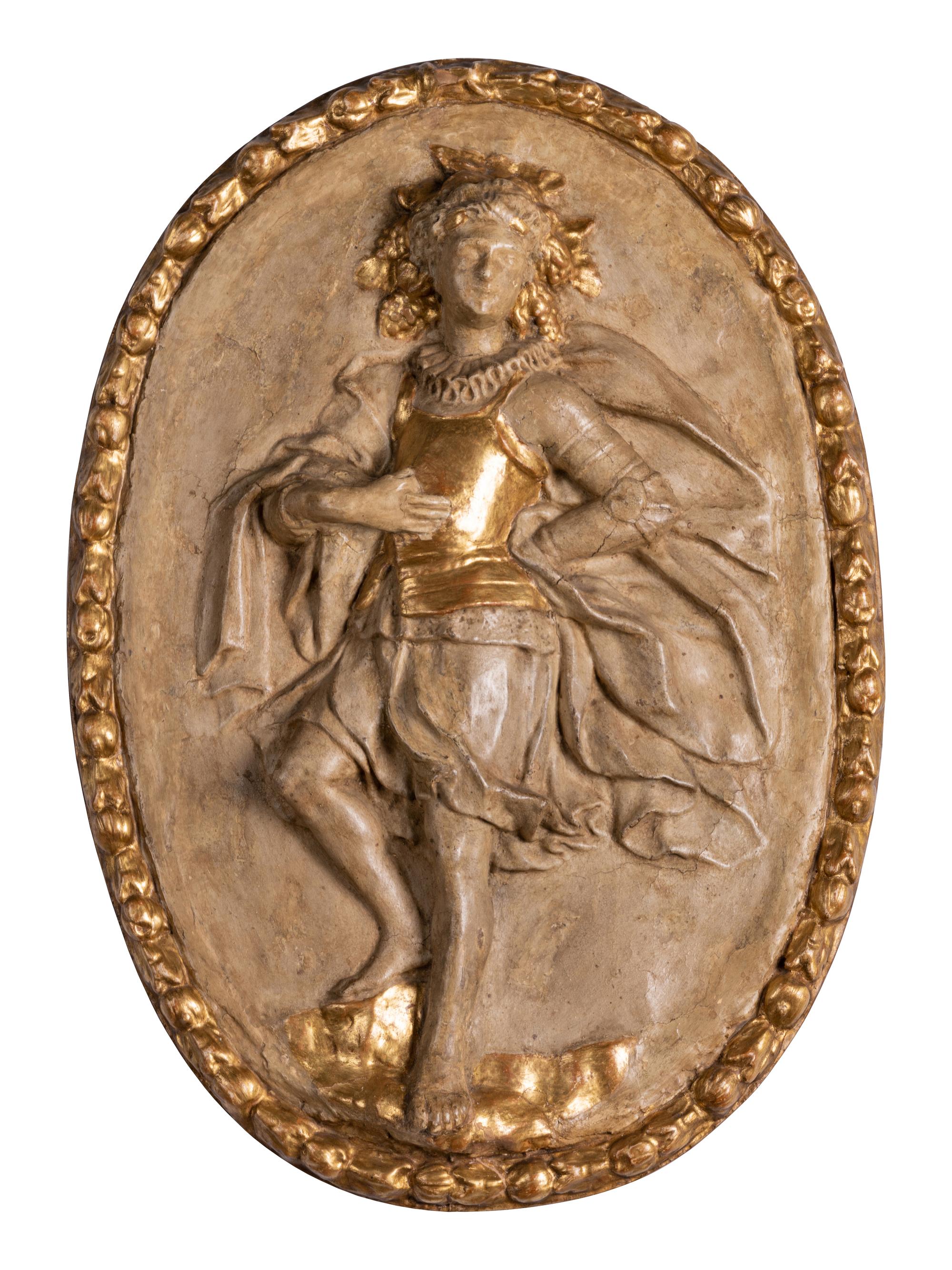 Four Italian Neoclassical Painted and Parcel-Gilt Papier-Mâché Relief Plaques
