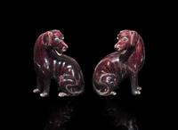 A pair of Chinese export aubergine-glazed porcelain seated dogs, 茄紫釉小狗一對