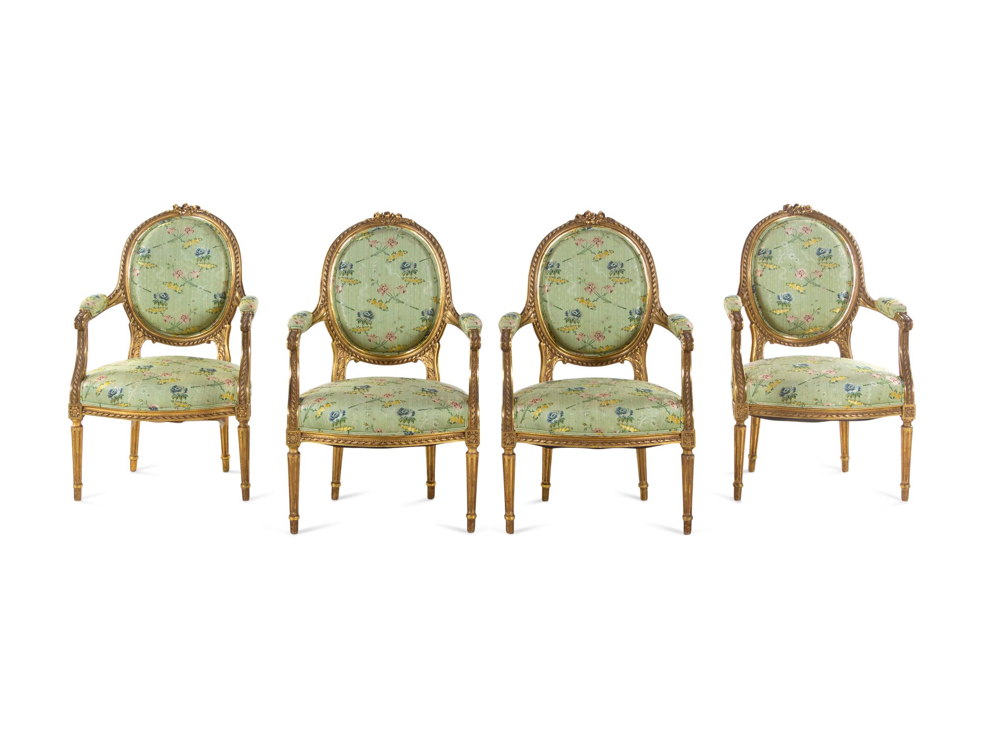 A Set of Four Louis XVI Style Carved Giltwood Fauteuils