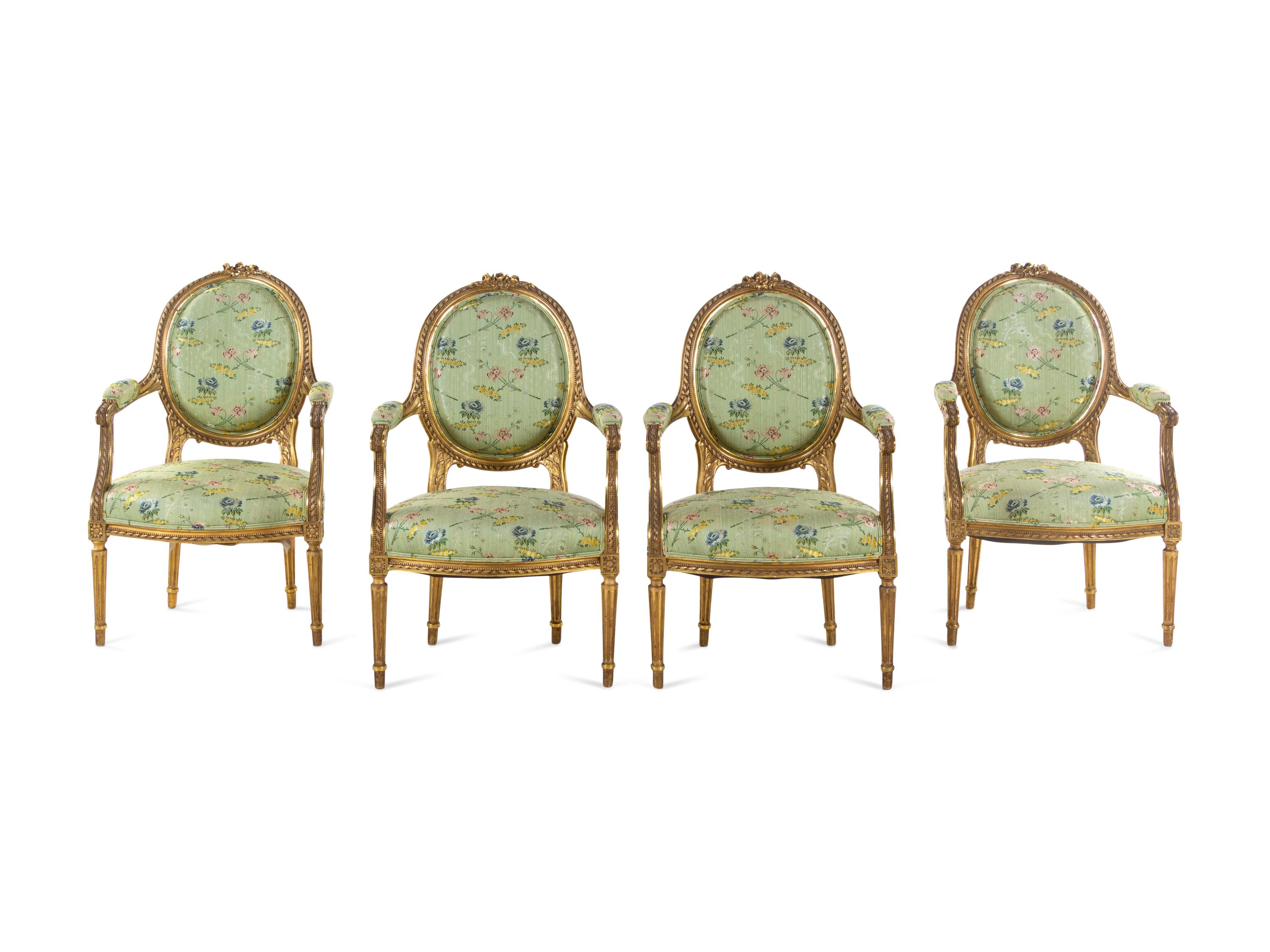 A Set of Four Louis XVI Style Carved Giltwood Fauteuils