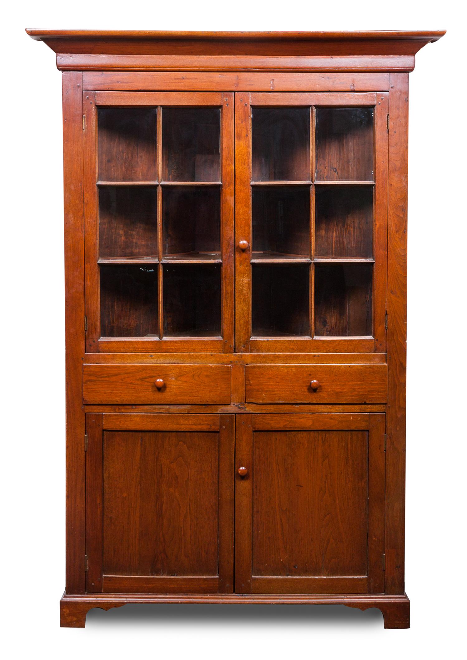 An American Corner Cabinet Height 78 1/2 x width 45 x depth 30 inches.