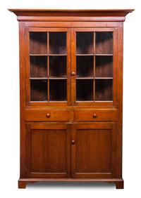 An American Corner Cabinet Height 78 1/2 x width 45 x depth 30 inches.