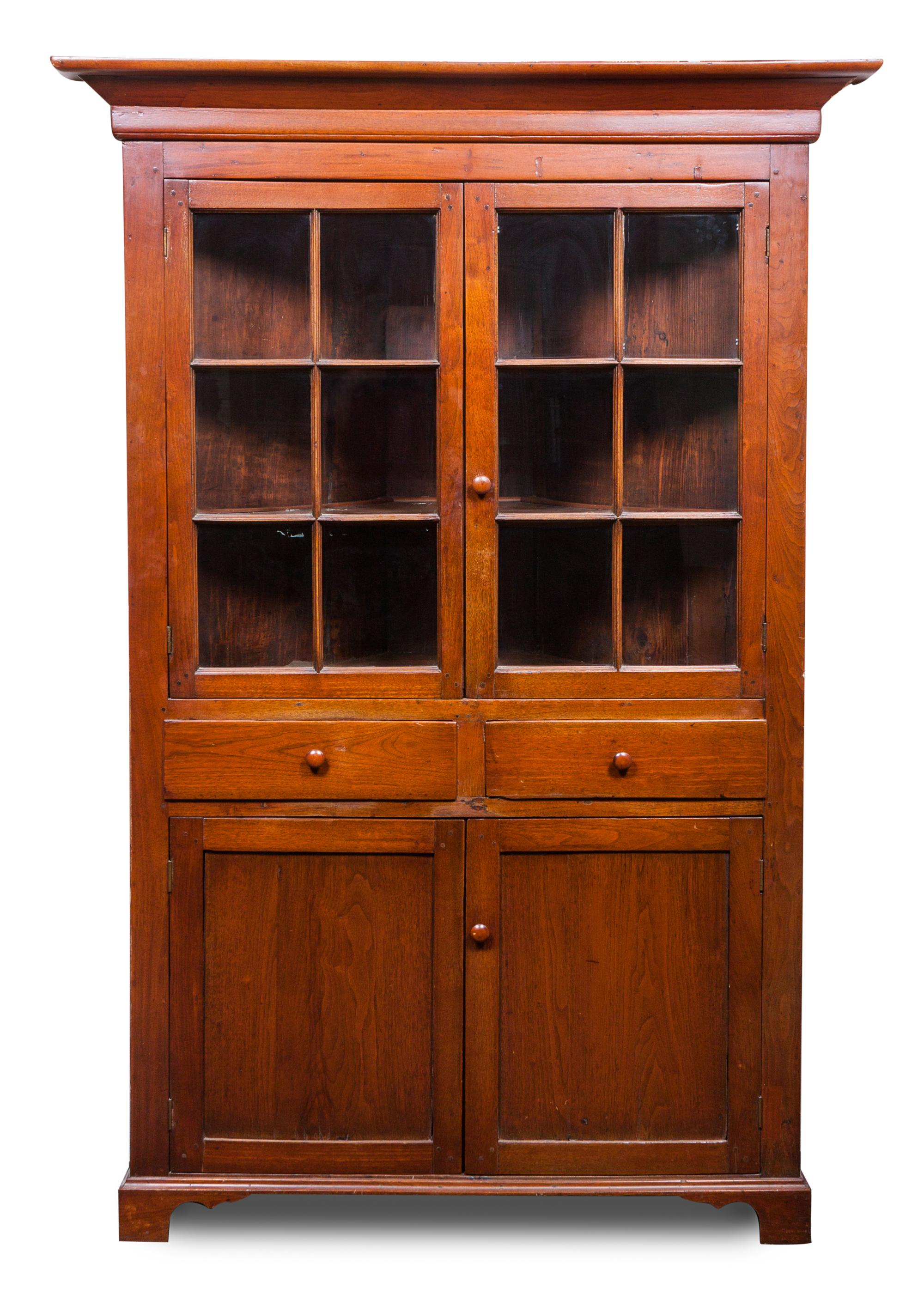 An American Corner Cabinet Height 78 1/2 x width 45 x depth 30 inches.