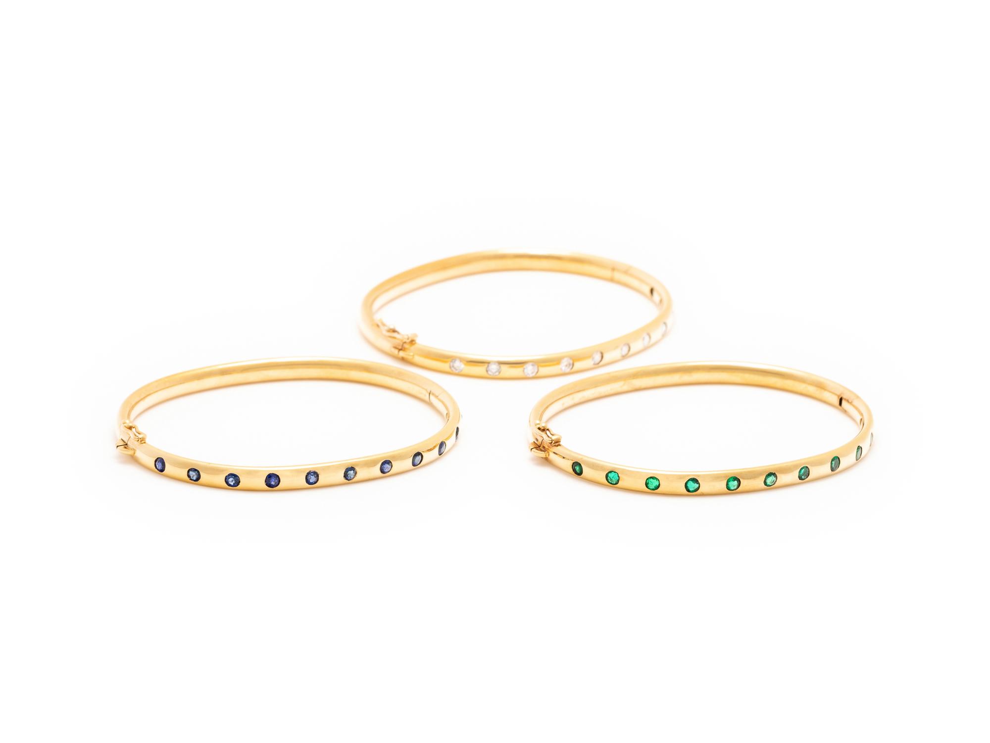 SCHLUGER, YELLOW GOLD, DIAMOND AND GEMSTONE BANGLE SET