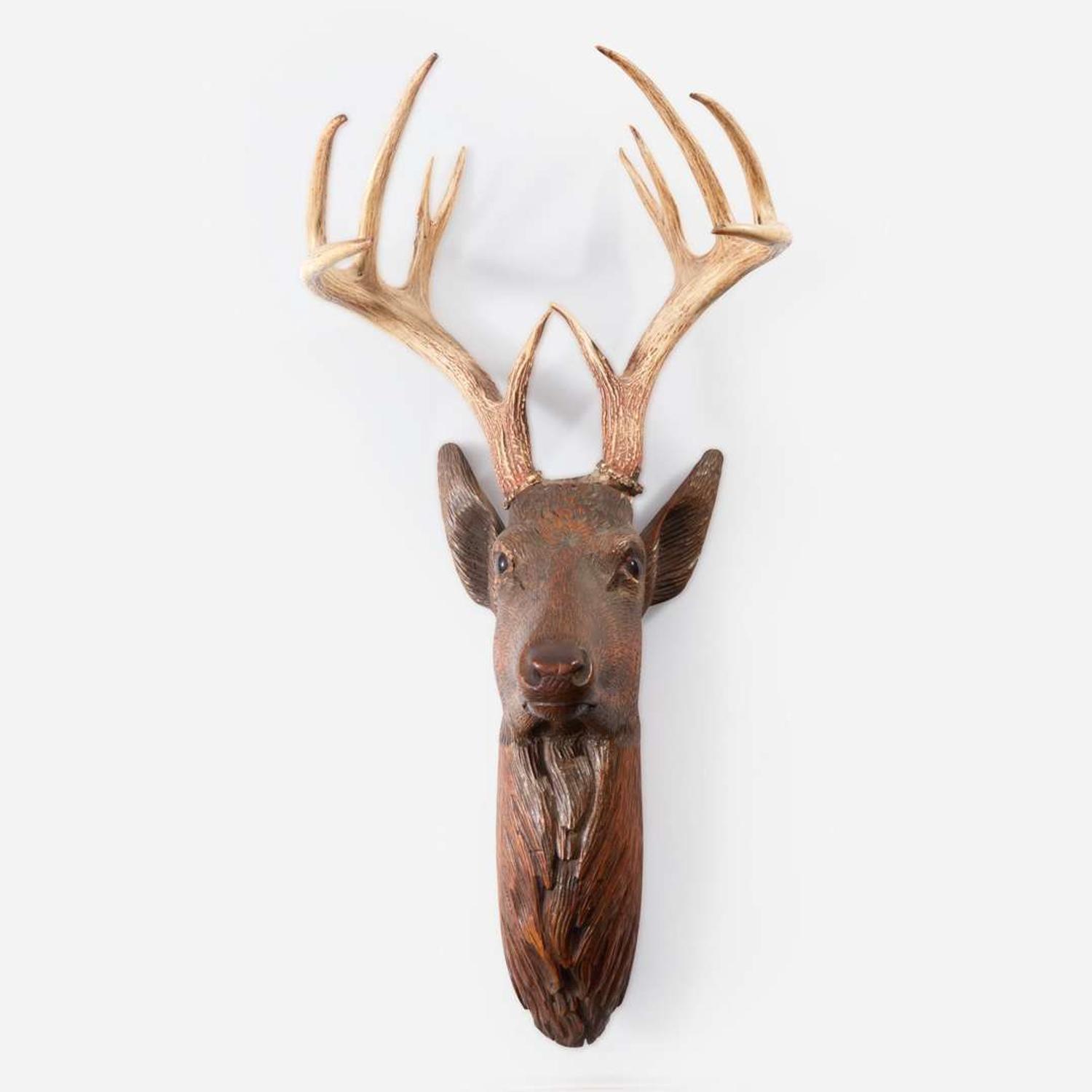 A Swiss Black Forest Carved Wood Stags Head late 19th/early 20th century